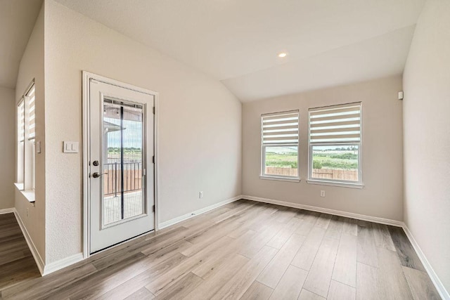 2871 Mill Run Bnd, Round Rock, TX 78665 - empty room with healthy amount of natural light, wood finished floors, and recessed lighting