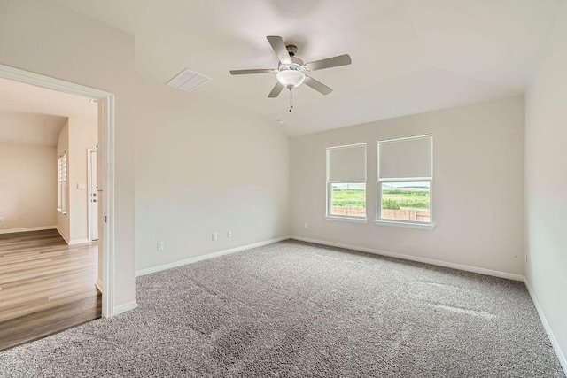 2871 Mill Run Bnd, Round Rock, TX 78665 - empty room with ceiling fan, carpet floors, and vaulted ceiling