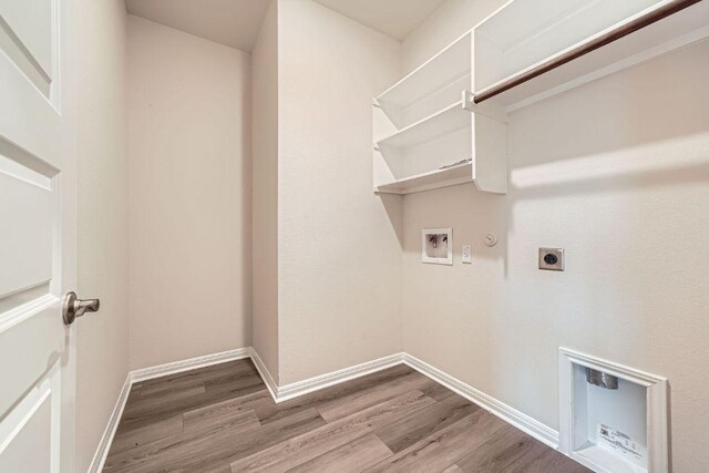 2871 Mill Run Bnd, Round Rock, TX 78665 - laundry room with electric dryer hookup, gas dryer hookup, wood finished floors, and hookup for a washing machine