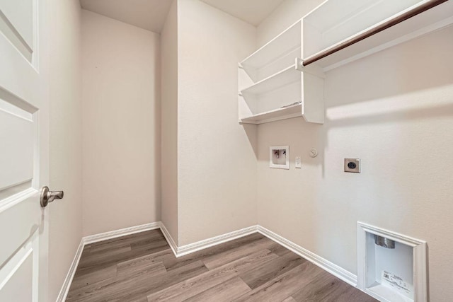 2871 Mill Run Bnd, Round Rock, TX 78665 - washroom with electric dryer hookup, gas dryer hookup, wood finished floors, and hookup for a washing machine