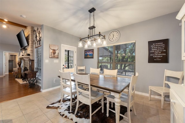 401 N Fox Xing, Burnet, TX 78611 - dining area featuring a stone fireplace and light tile patterned floors