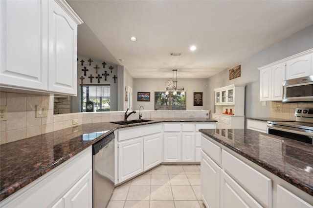 401 N Fox Xing, Burnet, TX 78611 - kitchen featuring stainless steel appliances, tasteful backsplash, white cabinets, and recessed lighting