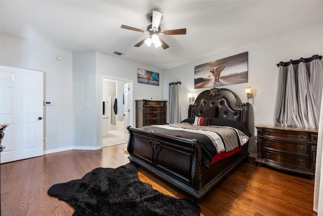 401 N Fox Xing, Burnet, TX 78611 - bedroom featuring wood finished floors, connected bathroom, and a ceiling fan