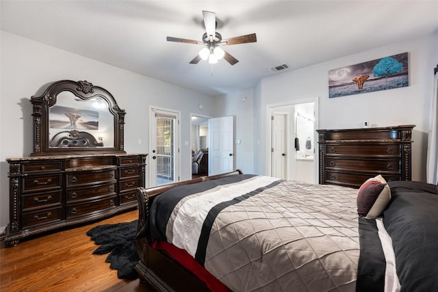401 N Fox Xing, Burnet, TX 78611 - bedroom featuring wood finished floors, access to outside, ensuite bathroom, and a ceiling fan