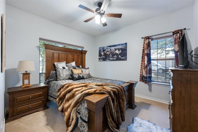 401 N Fox Xing, Burnet, TX 78611 - bedroom with light colored carpet and a ceiling fan