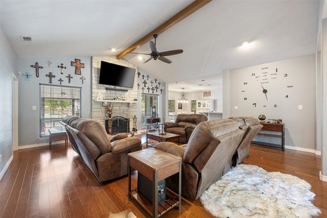 401 N Fox Xing, Burnet, TX 78611 - living area with ceiling fan, a fireplace, wood finished floors, and a chandelier