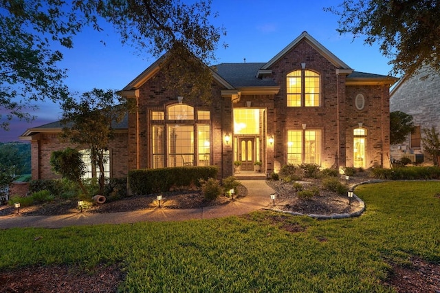 10008 Inshore Dr, Austin, TX 78730 - view of front of house with brick siding and a yard