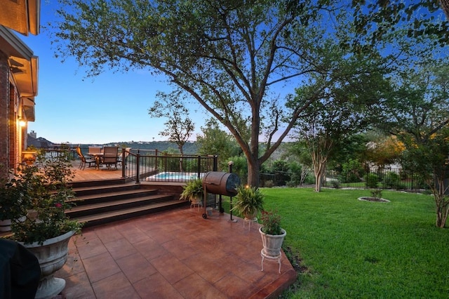 10008 Inshore Dr, Austin, TX 78730 - fenced backyard featuring a wooden deck, a patio, and outdoor dining space
