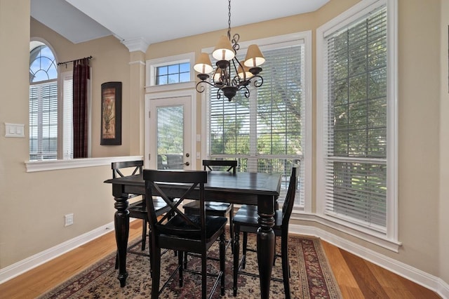 10008 Inshore Dr, Austin, TX 78730 - dining room featuring a chandelier and wood finished floors