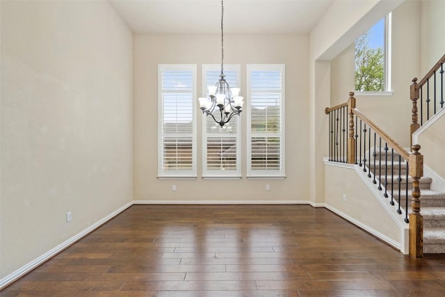 5505 Cypress Ranch Blvd, Spicewood, TX 78669 - unfurnished dining area with a chandelier, dark wood-style flooring, and stairs