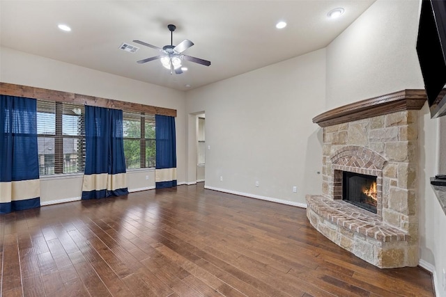 5505 Cypress Ranch Blvd, Spicewood, TX 78669 - unfurnished living room featuring ceiling fan, wood-type flooring, a stone fireplace, and recessed lighting