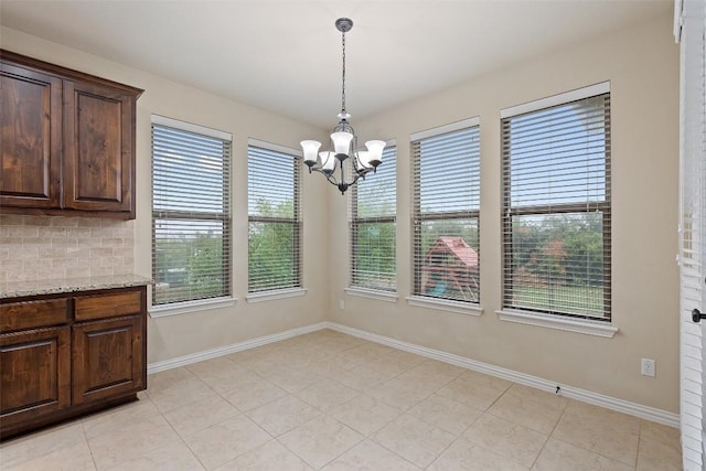 5505 Cypress Ranch Blvd, Spicewood, TX 78669 - unfurnished dining area featuring a chandelier and light tile patterned floors
