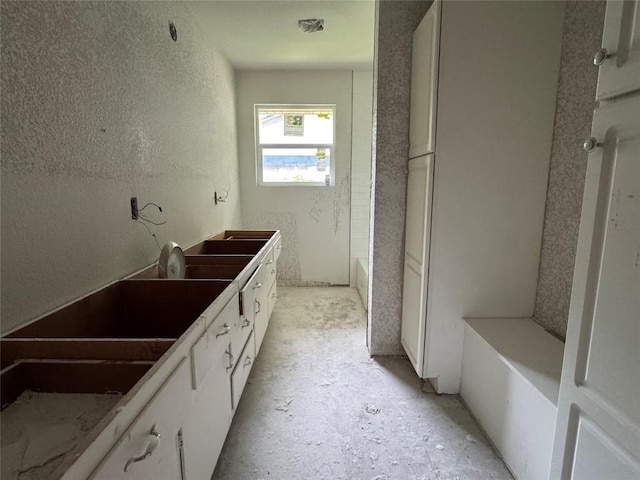 11302 Eubank Dr, Austin, TX 78758 - full bathroom with vanity and a textured wall