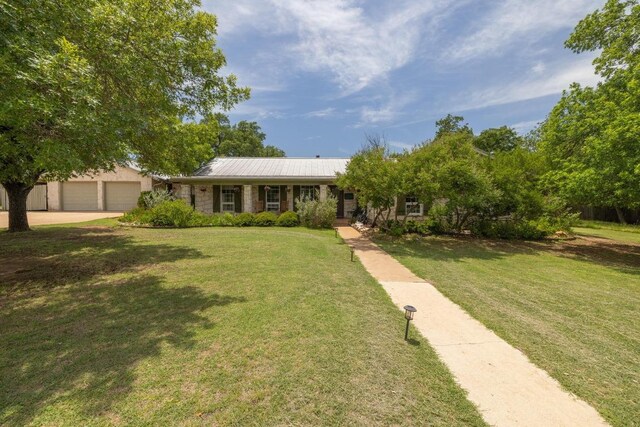 116 Ridgecrest Rd, Georgetown, TX 78628 - view of front of property with a front lawn, a garage, and concrete driveway