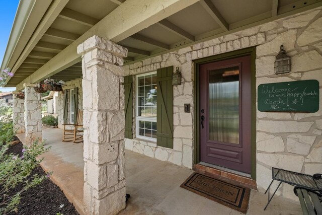 116 Ridgecrest Rd, Georgetown, TX 78628 - property entrance with stone siding and a porch