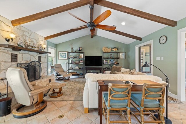 116 Ridgecrest Rd, Georgetown, TX 78628 - living area with light tile patterned flooring, ceiling fan, and a stone fireplace