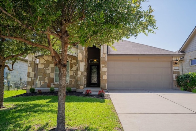 11612 Yeadon Way, Austin, TX 78717 - view of front of home featuring driveway, an attached garage, a front lawn, stone siding, and a shingled roof