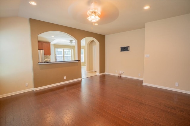 11612 Yeadon Way, Austin, TX 78717 - spare room with ceiling fan, arched walkways, dark wood-style flooring, and recessed lighting