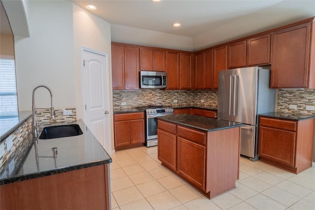 11612 Yeadon Way, Austin, TX 78717 - kitchen with appliances with stainless steel finishes, dark stone countertops, backsplash, light tile patterned flooring, and recessed lighting