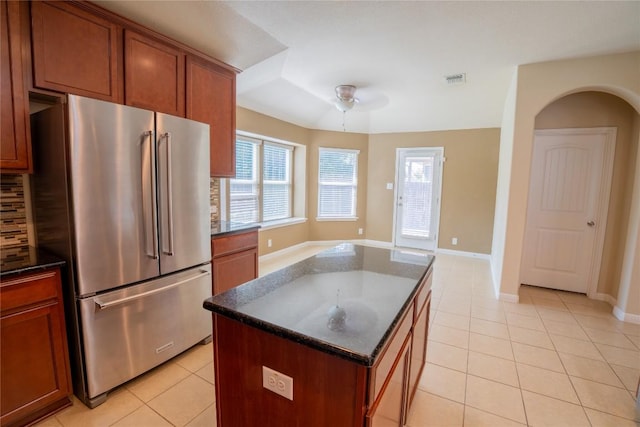 11612 Yeadon Way, Austin, TX 78717 - kitchen with high quality fridge, light tile patterned floors, and healthy amount of natural light