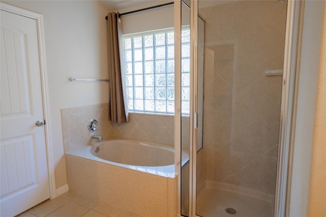 11612 Yeadon Way, Austin, TX 78717 - bathroom with plenty of natural light, a bath, tile patterned floors, and a stall shower