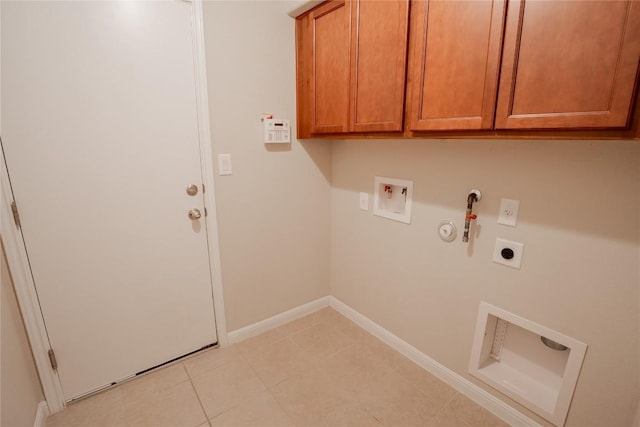 11612 Yeadon Way, Austin, TX 78717 - laundry room with hookup for a gas dryer, electric dryer hookup, cabinet space, washer hookup, and light tile patterned floors