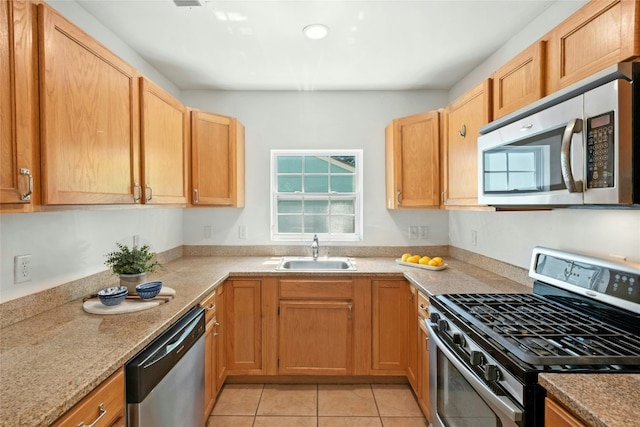 1510 Circle Dr, Round Rock, TX 78664 - kitchen featuring appliances with stainless steel finishes, light tile patterned floors, and light stone counters