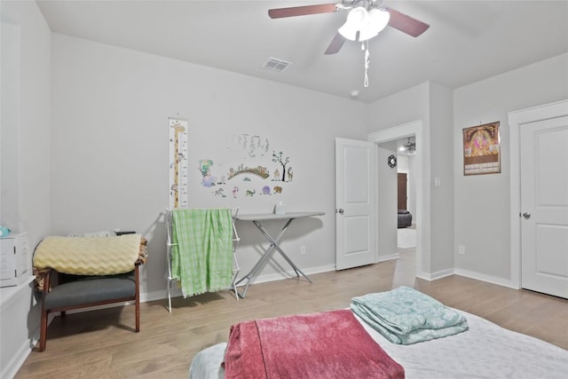 1519 Fenton Hill Dr, Leander, TX 78641 - bedroom featuring wood finished floors and ceiling fan