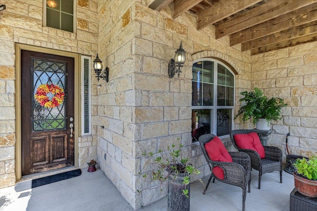 11600 Santa Elena Ln, Austin, TX 78717 - view of exterior entry featuring stone siding and covered porch