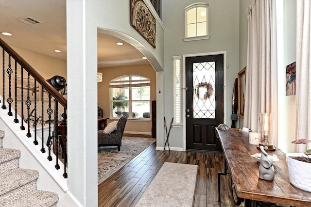 11600 Santa Elena Ln, Austin, TX 78717 - foyer with arched walkways, dark wood-style flooring, stairway, and recessed lighting