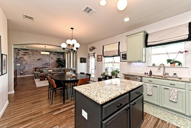 11600 Santa Elena Ln, Austin, TX 78717 - kitchen featuring dark wood-style flooring, a chandelier, open floor plan, green cabinetry, and recessed lighting