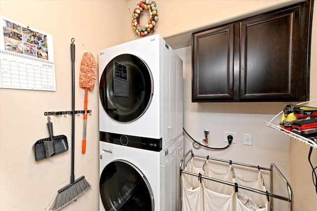 11600 Santa Elena Ln, Austin, TX 78717 - laundry area featuring estacked washer and dryer and cabinet space