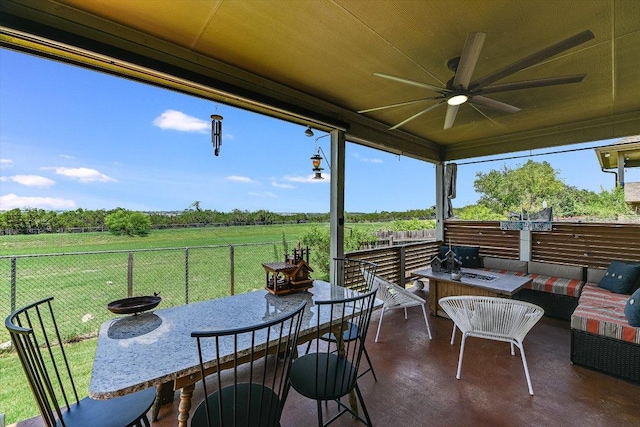 11600 Santa Elena Ln, Austin, TX 78717 - fenced backyard with an outdoor living space, a ceiling fan, a view of countryside, and outdoor dining space