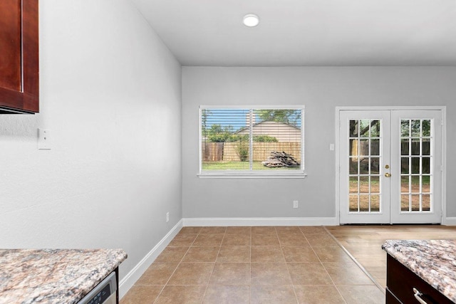 1207 York Castle Dr, Pflugerville, TX 78660 - unfurnished dining area featuring french doors and baseboards