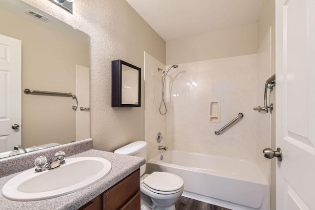 132 Hillhouse Ln, Manchaca, TX 78652 - full bathroom with shower / bath combination, vanity, wood finished floors, and a textured wall
