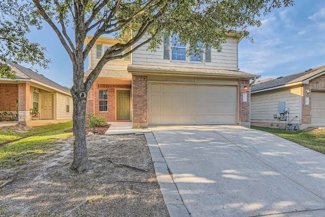 132 Hillhouse Ln, Manchaca, TX 78652 - traditional-style house featuring brick siding, a garage, and concrete driveway