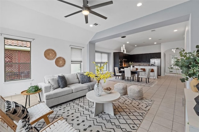 12221 Fairway Cv, Austin, TX 78732 - living room with vaulted ceiling, ceiling fan, light tile patterned floors, recessed lighting, and arched walkways