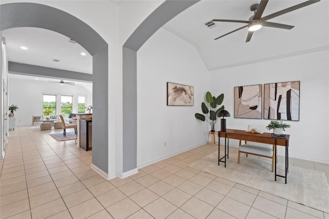 12221 Fairway Cv, Austin, TX 78732 - corridor featuring arched walkways, light tile patterned floors, a desk, vaulted ceiling, and recessed lighting