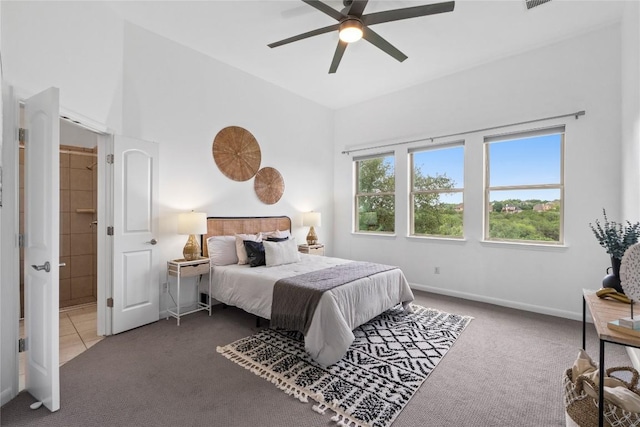 12221 Fairway Cv, Austin, TX 78732 - carpeted bedroom featuring ceiling fan and a high ceiling