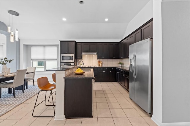 12221 Fairway Cv, Austin, TX 78732 - kitchen featuring stainless steel appliances, light tile patterned floors, tasteful backsplash, dark stone countertops, and recessed lighting