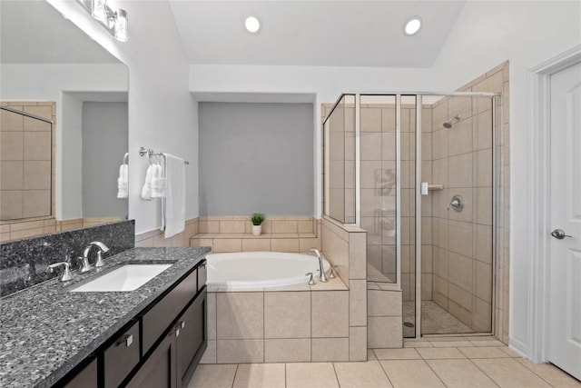 12221 Fairway Cv, Austin, TX 78732 - bathroom featuring vanity, a garden tub, a stall shower, tile patterned flooring, and recessed lighting