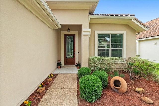 12221 Fairway Cv, Austin, TX 78732 - property entrance featuring stucco siding and a tiled roof