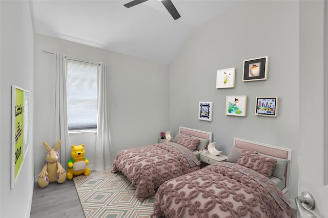 12221 Fairway Cv, Austin, TX 78732 - bedroom featuring vaulted ceiling, wood finished floors, and a ceiling fan