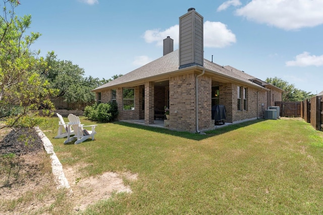 139 Merion Dr, Austin, TX 78737 - rear view of property with a chimney, brick siding, a fenced backyard, and a patio area