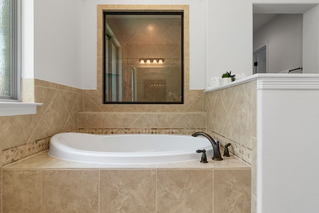 139 Merion Dr, Austin, TX 78737 - bathroom featuring a garden tub and tiled shower