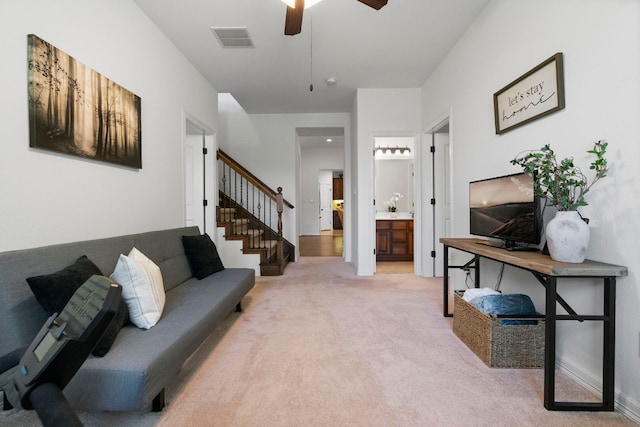 139 Merion Dr, Austin, TX 78737 - living area with stairs, light colored carpet, and ceiling fan
