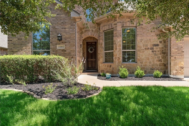 139 Merion Dr, Austin, TX 78737 - property entrance featuring stone siding and a lawn