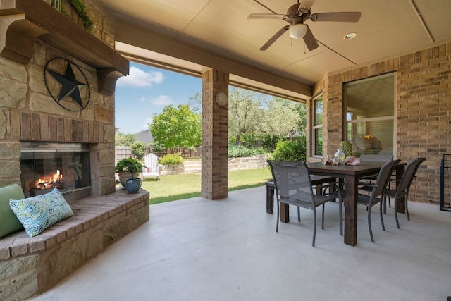 139 Merion Dr, Austin, TX 78737 - view of patio featuring an outdoor stone fireplace, outdoor dining area, and ceiling fan