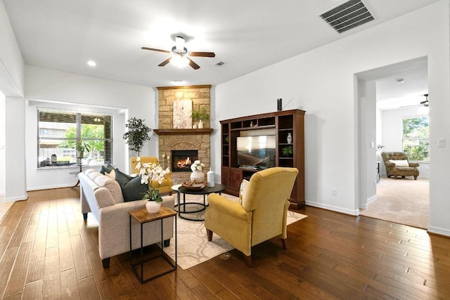 139 Merion Dr, Austin, TX 78737 - living area featuring ceiling fan, a stone fireplace, hardwood / wood-style flooring, and recessed lighting