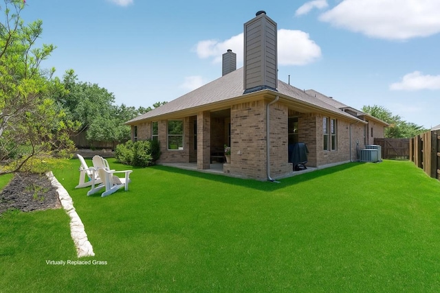 139 Merion Dr, Austin, TX 78737 - back of house with a chimney, a fenced backyard, and brick siding